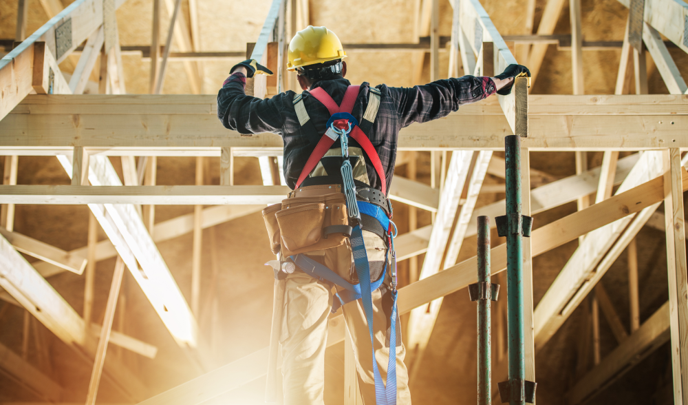 Construction framer working on building trusses