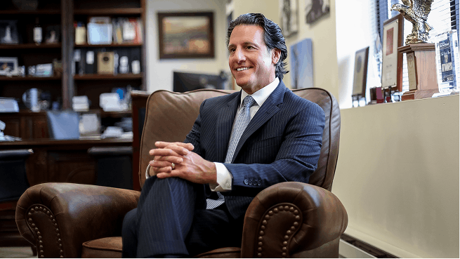 Daryl Zaslow sitting in office