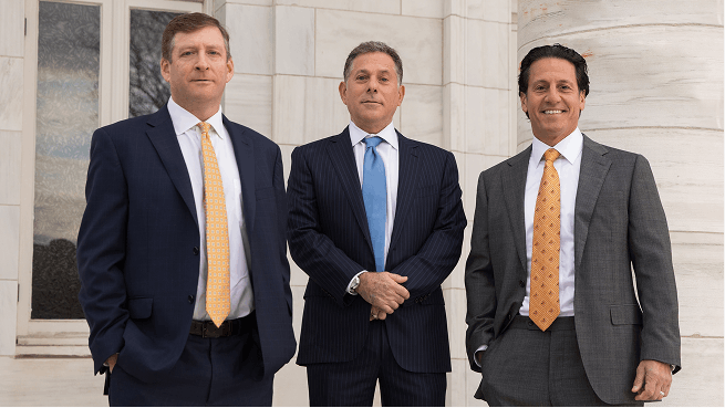 Attorneys standing outside courthouse