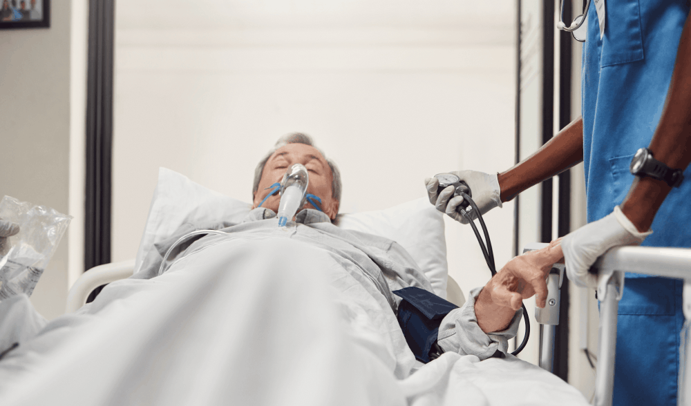 Man in hospital bed suffering from burn injury